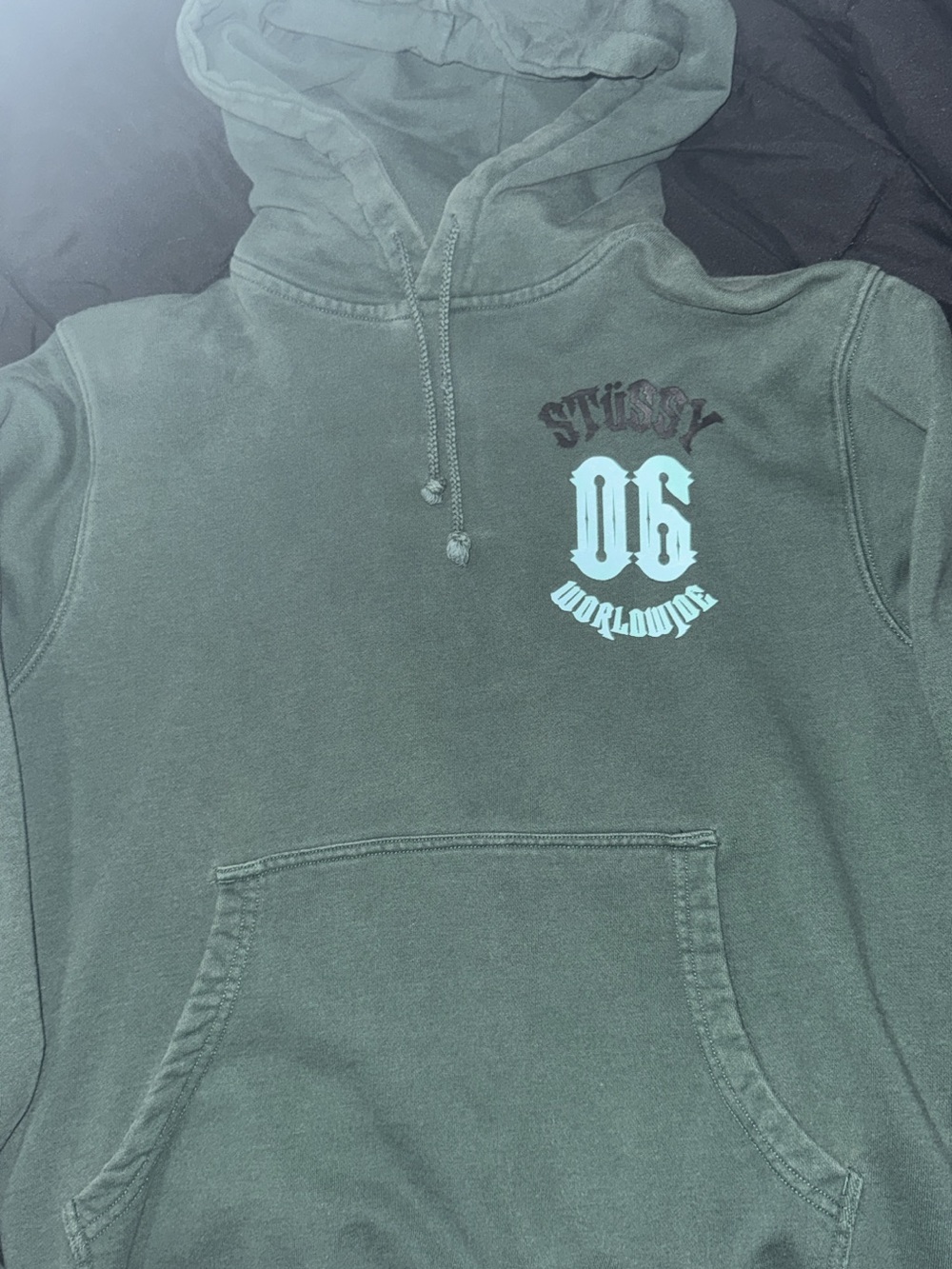 Stussy Olive Green OG Worldwide Hoodie with Light Blue Graphic